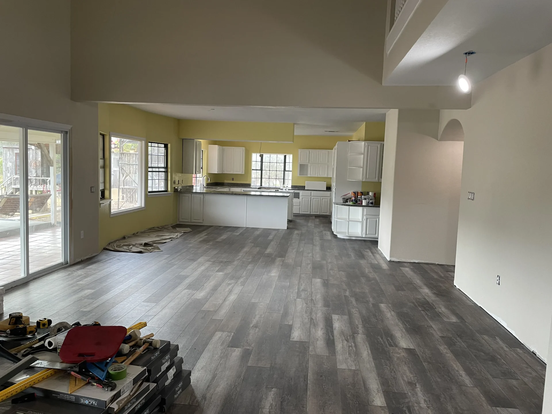 Open-plan kitchen and living area, under renovation.