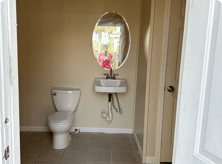 Small bathroom with toilet and sink.