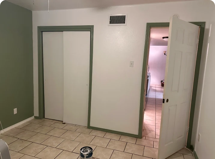 Empty room with tiled floor and doorway.